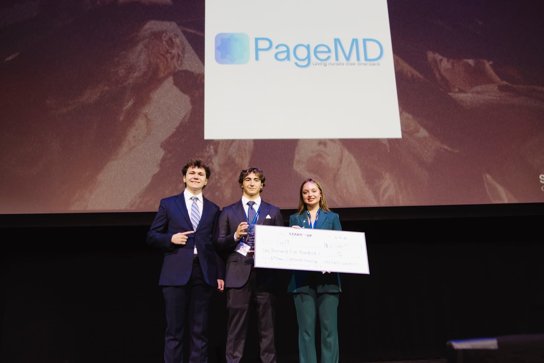 The PageMD team presenting on stage